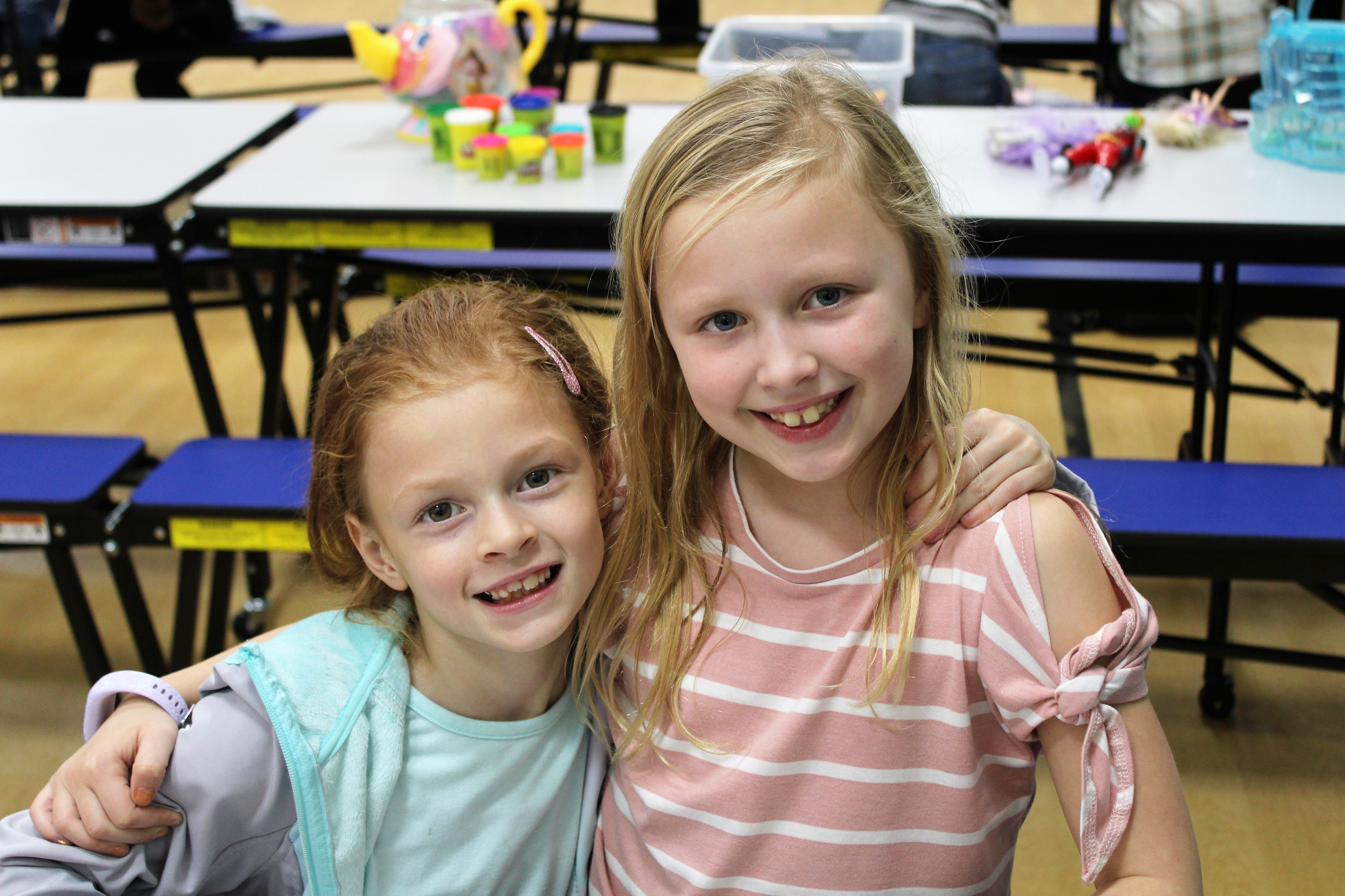 Two girls smiling 