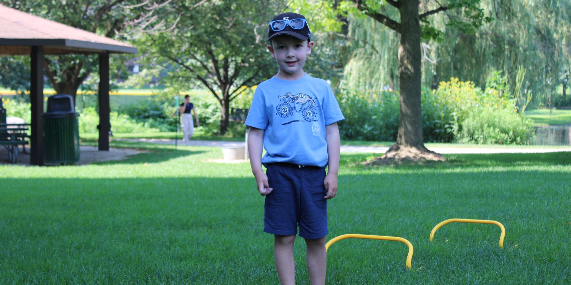 Boy outside in grass