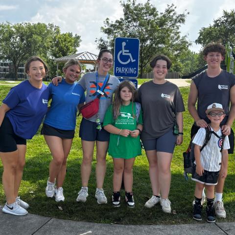 Staff at camp with children 